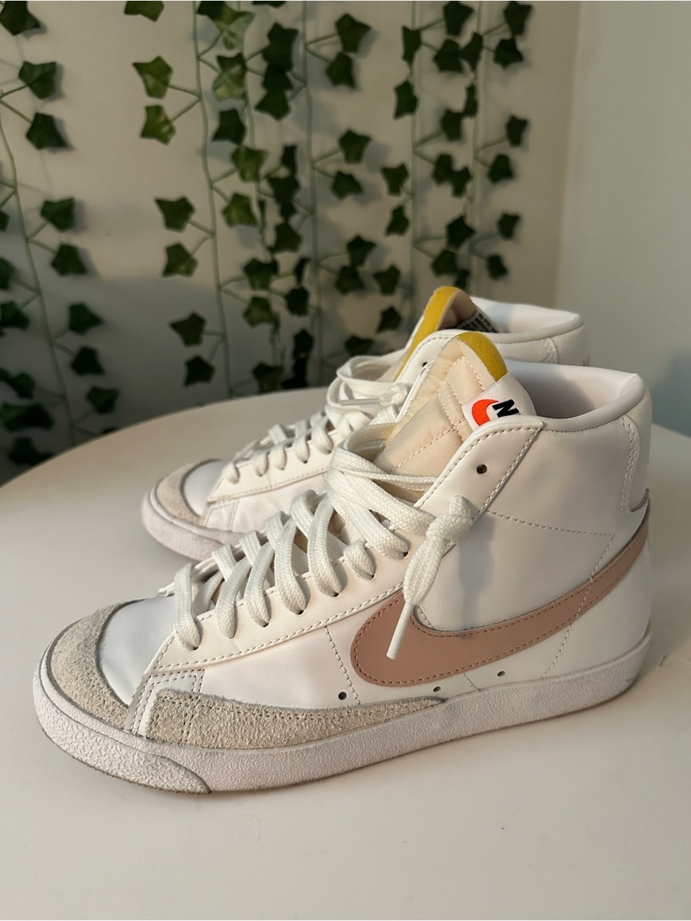 Nike Women’s Blazer Mid Sneakers in White with Pink Swoosh